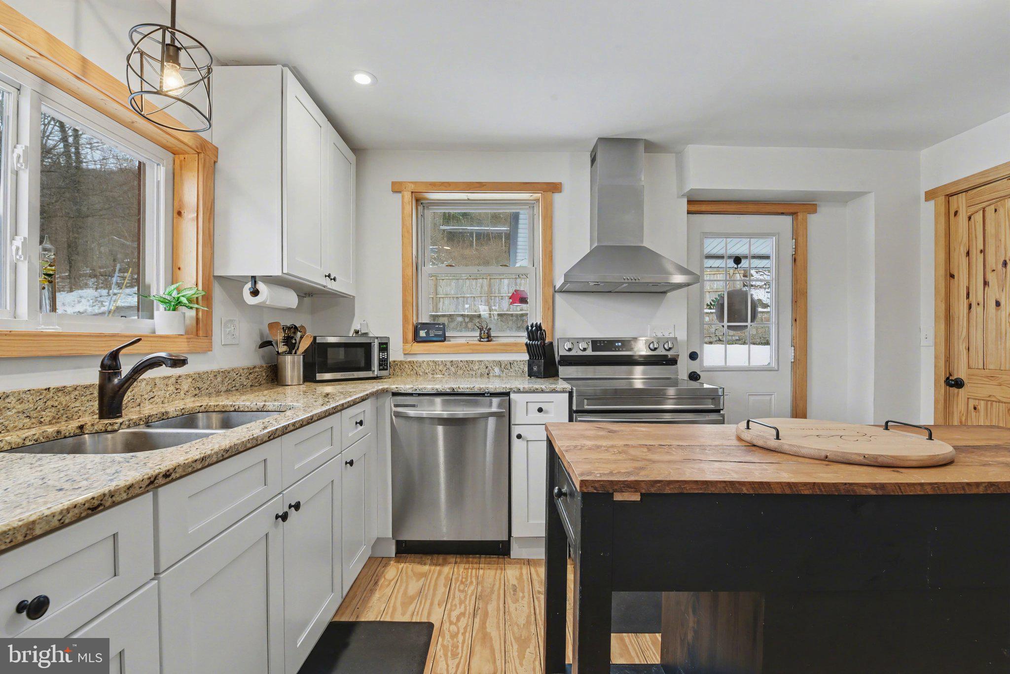 1117 State Road Duncannon, PA 17020 - Photo 5 of 29 a kitchen with a sink stove and cabinets