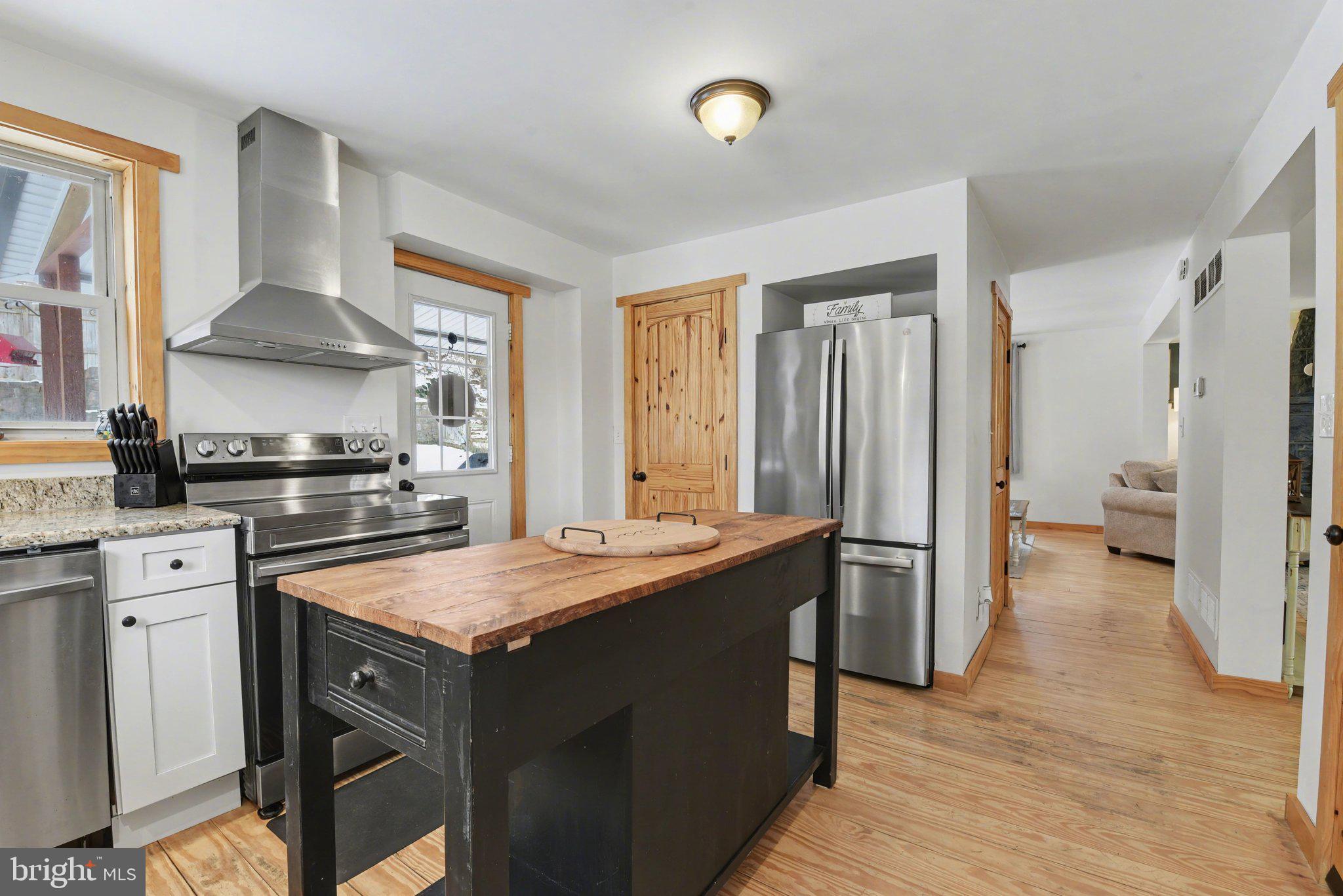1117 State Road Duncannon, PA 17020 - Photo 7 of 29 a kitchen with a stove a sink and a refrigerator