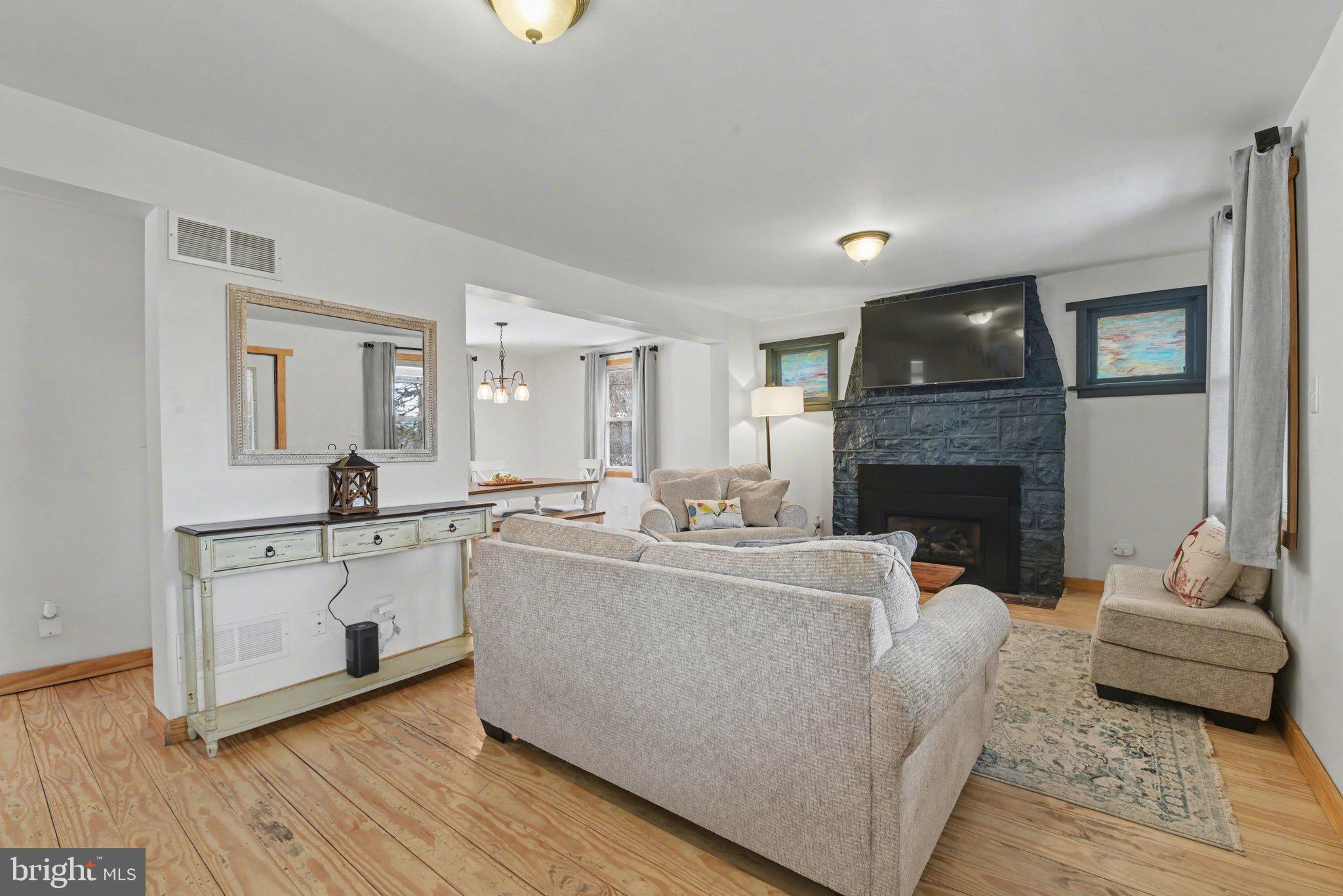 1117 State Road Duncannon, PA 17020 - Photo 10 of 29 a living room with furniture a fireplace and a fireplace