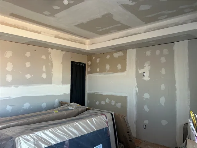 a bedroom with a large window