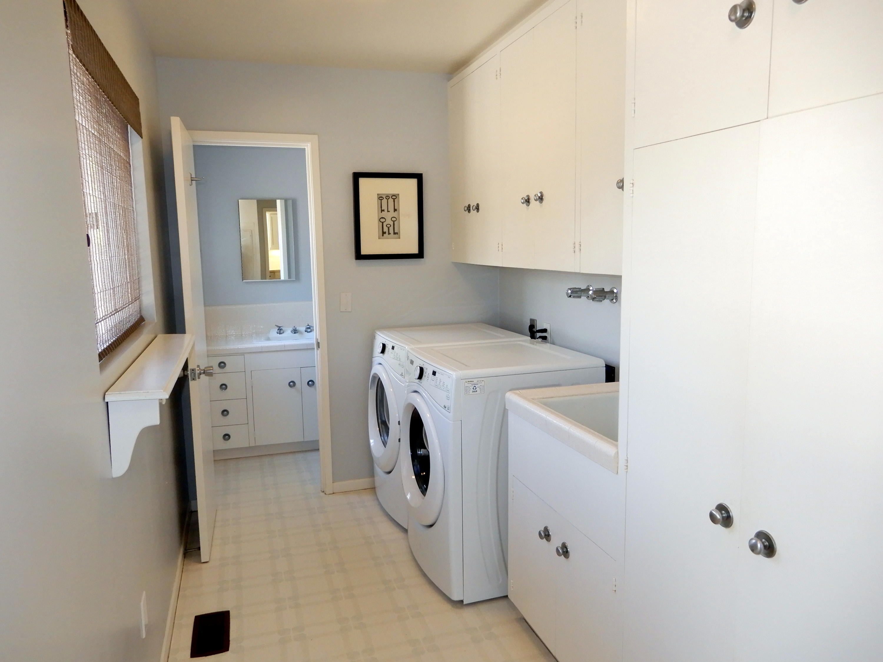 166 Toro Canyon Road Carpinteria, CA 93013 - Photo 11 of 11 a utility room with dryer and washer