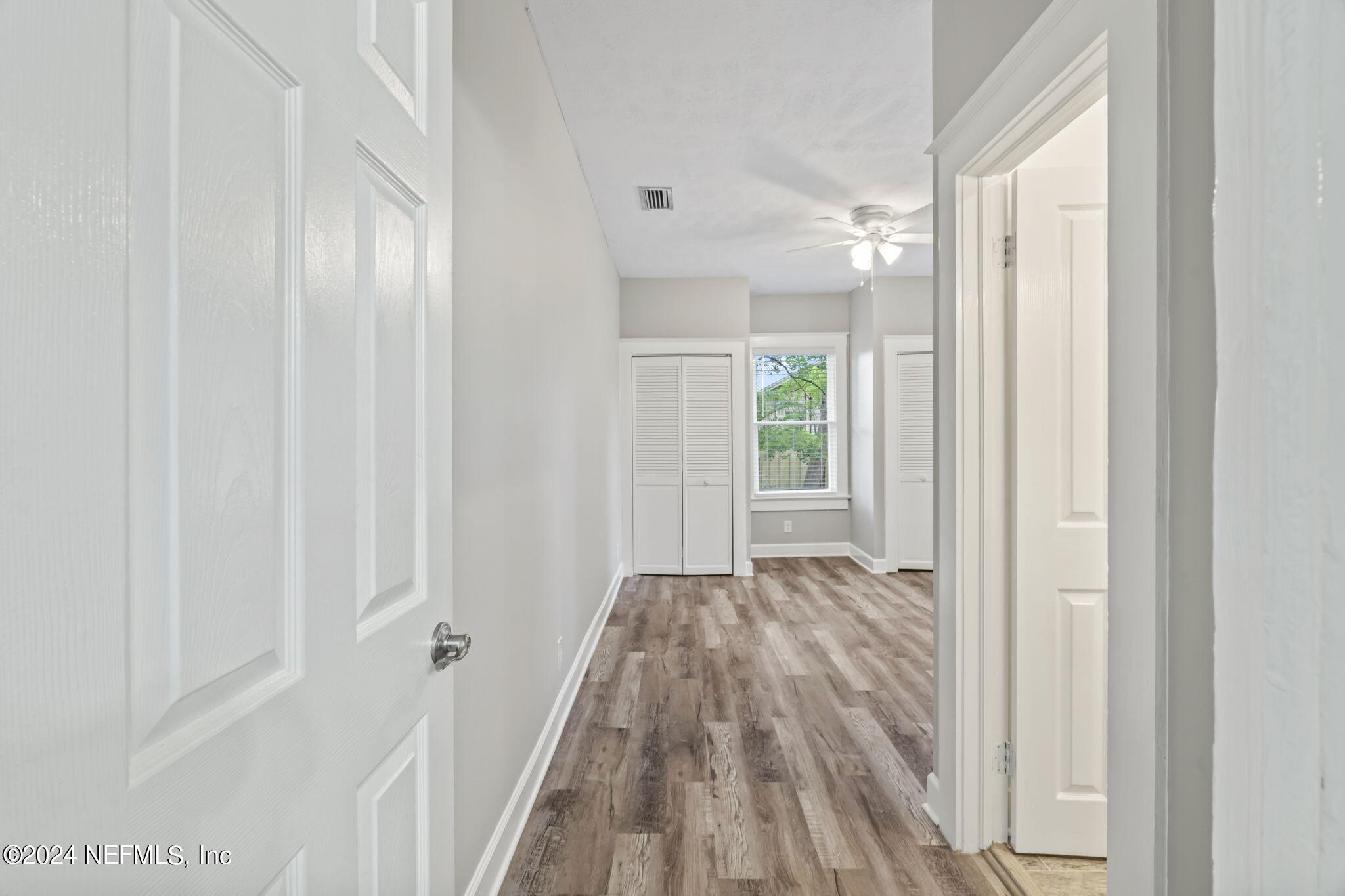 64 Carrera Street St. Augustine, FL 32084 - Photo 25 of 84 a view of a hallway with wooden floor and a bathroom