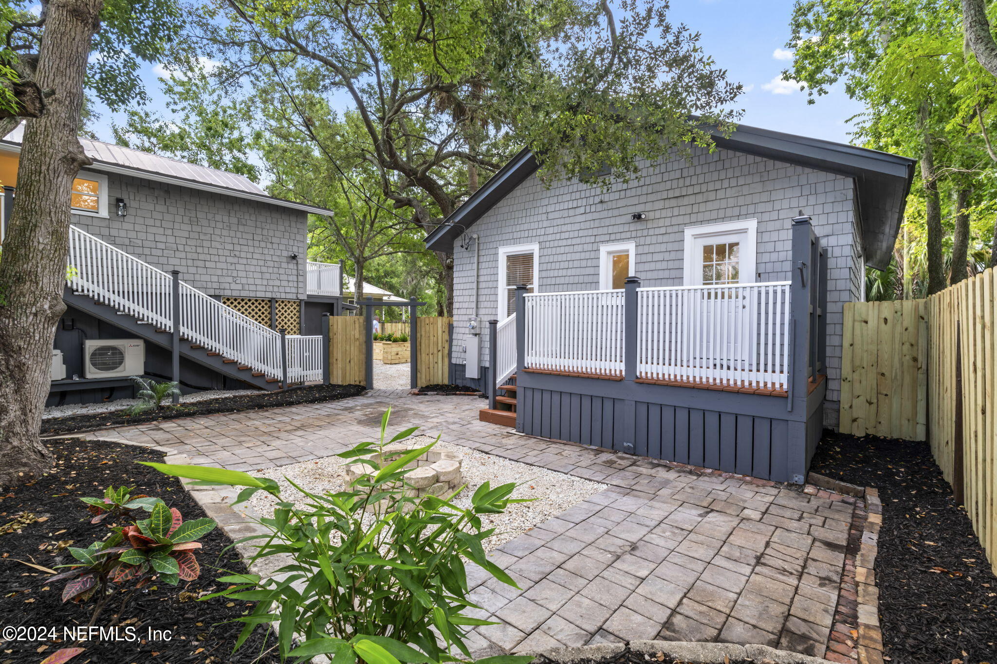 64 Carrera Street St. Augustine, FL 32084 - Photo 35 of 84 a front view of a house with a garden
