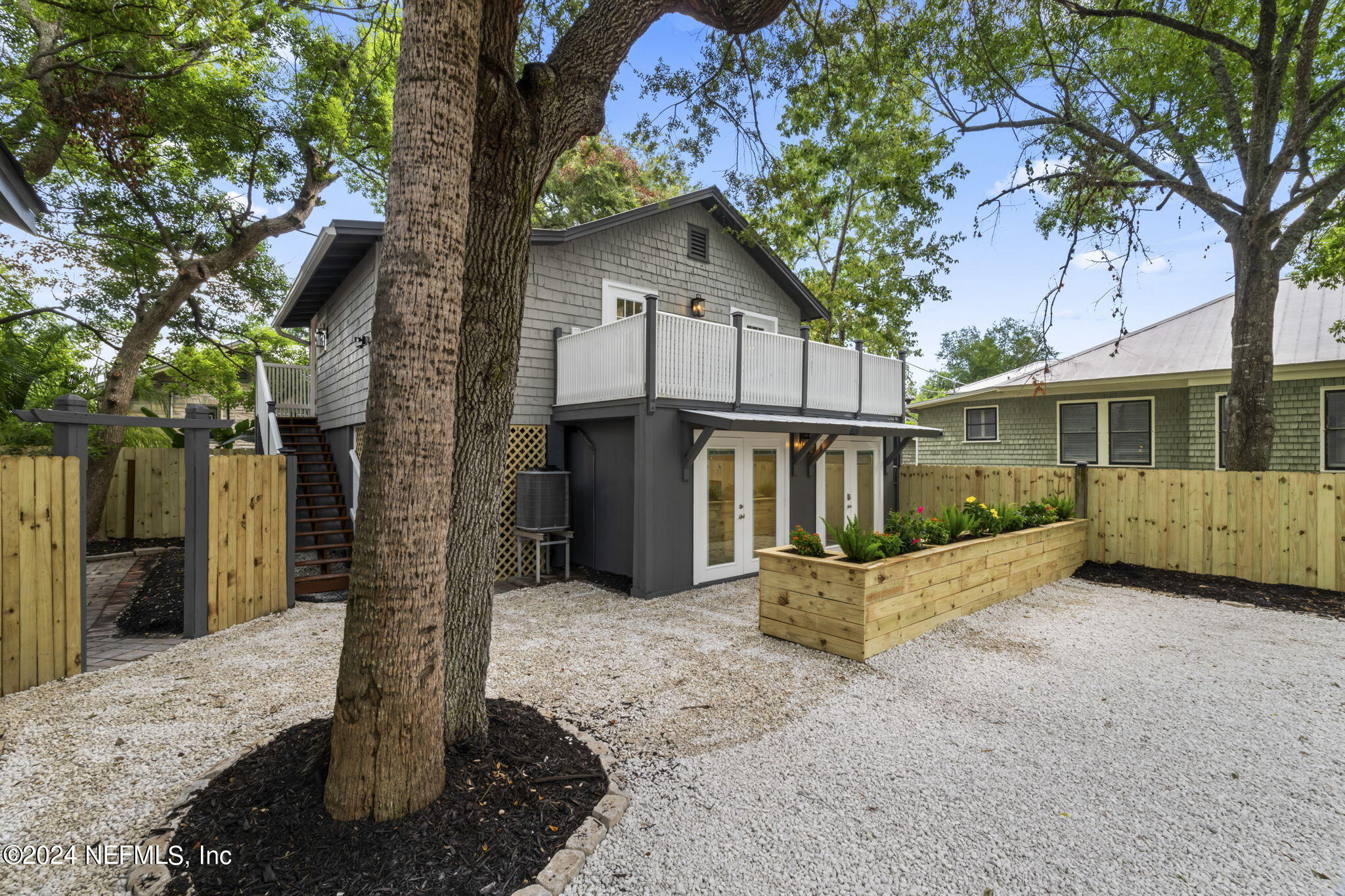 64 Carrera Street St. Augustine, FL 32084 - Photo 38 of 84 a front view of a house with a yard covered with snow in front of house