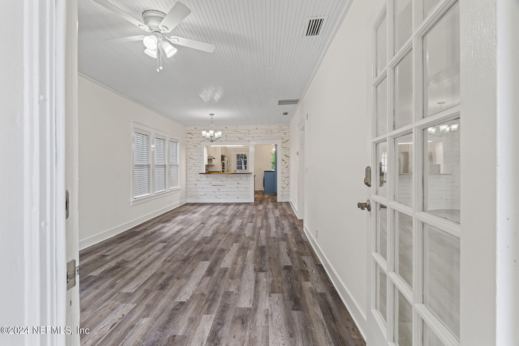 64 Carrera Street St. Augustine, FL 32084 - Photo 10 of 84 a view of a hallway with wooden floor and a kitchen