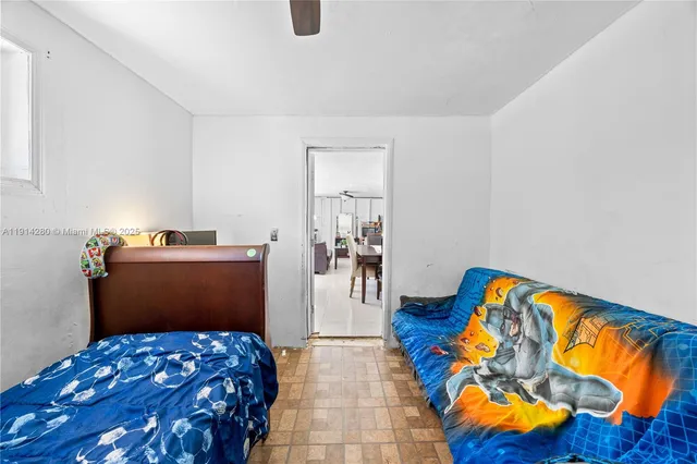 a view of an empty room and bedroom