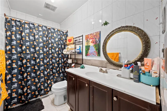 a living room with furniture and a lamp