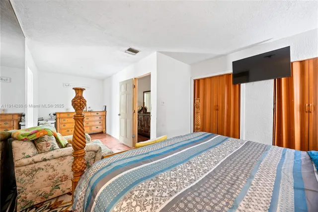 a bed room with a bed and a window