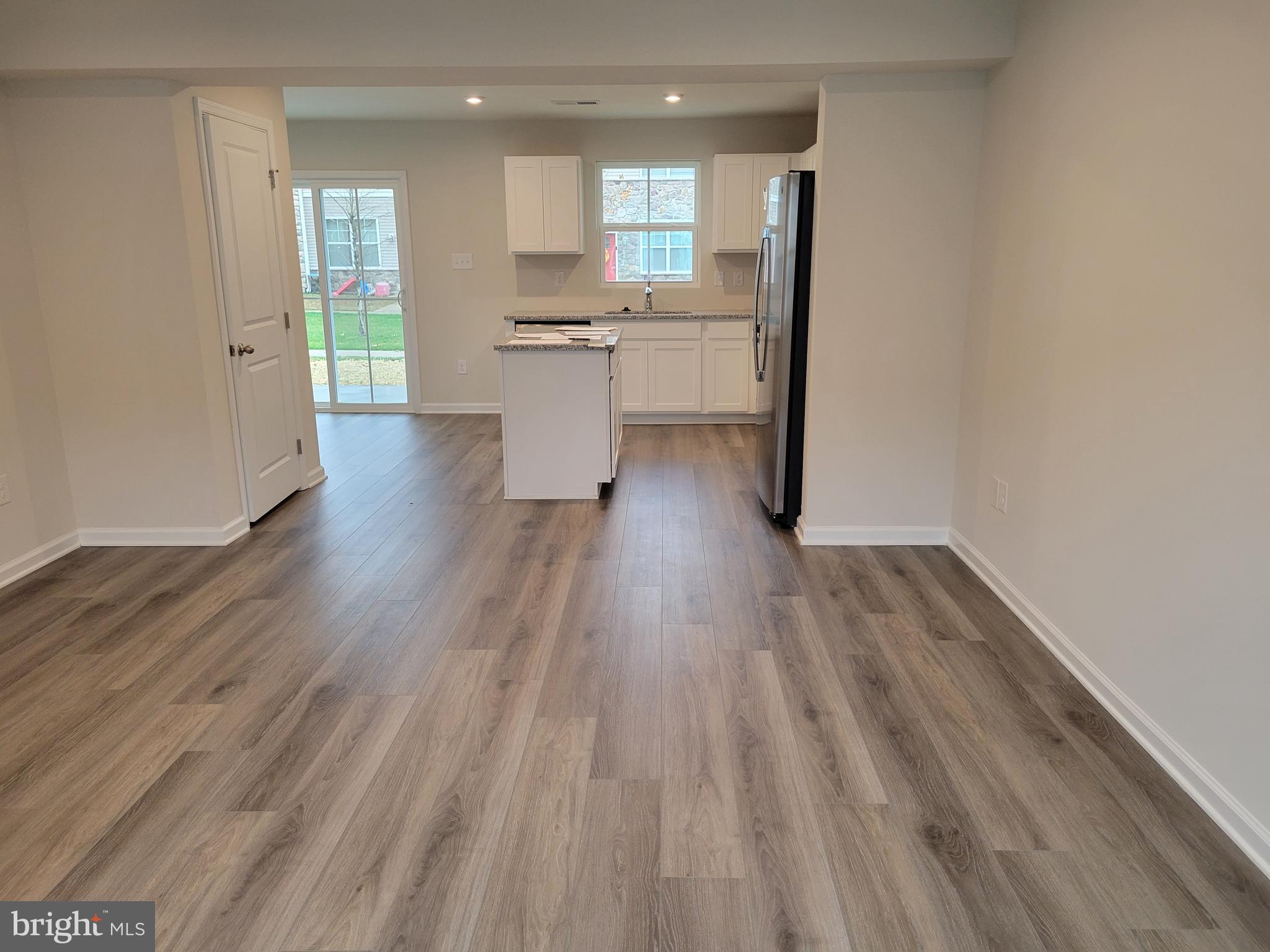 24 Mulberry Lane Clementon, NJ 08021 - Photo 5 of 13 a view of a kitchen with wooden floor and a window