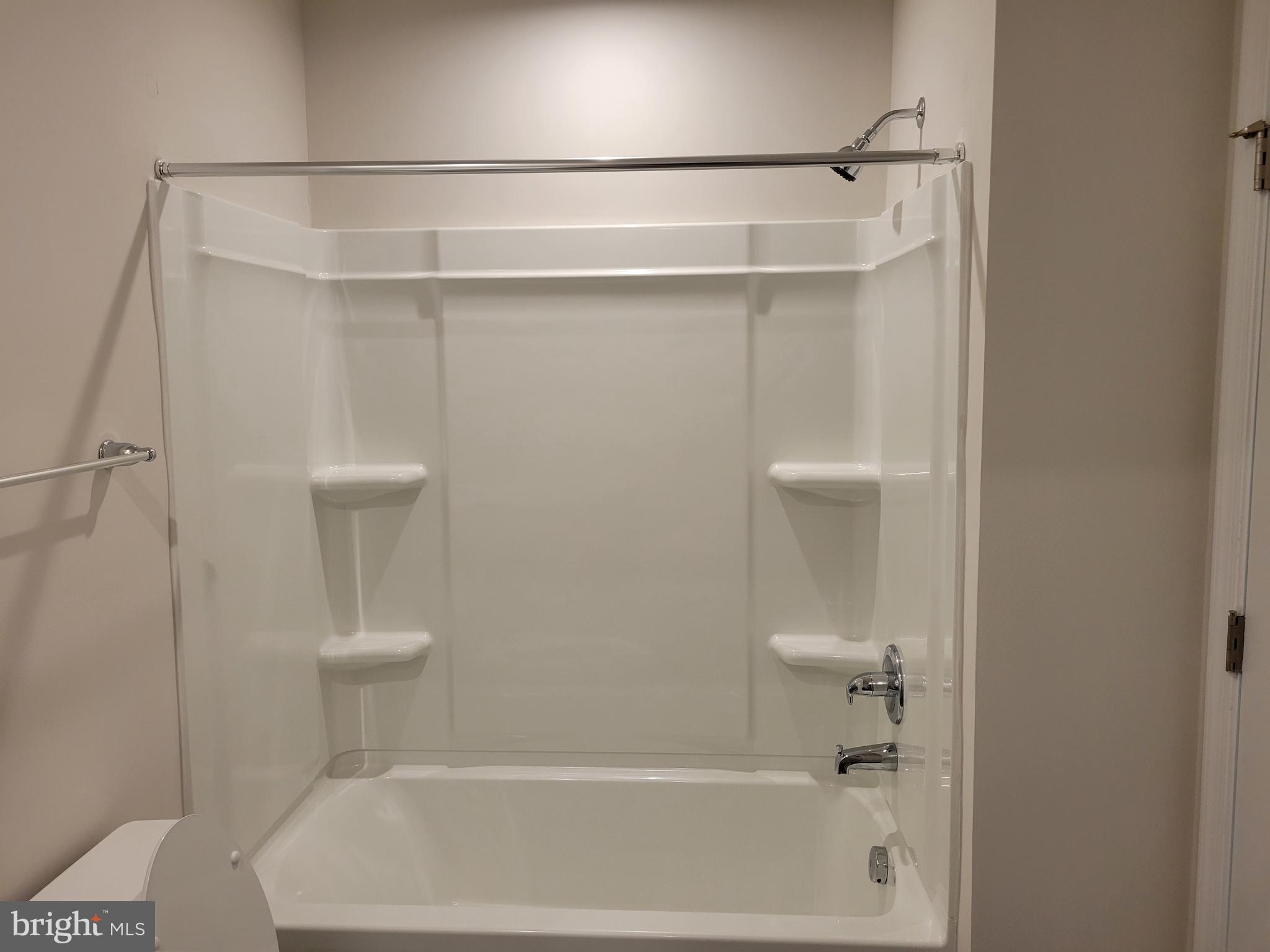 24 Mulberry Lane Clementon, NJ 08021 - Photo 7 of 13 a bathroom with a shower and a toilet