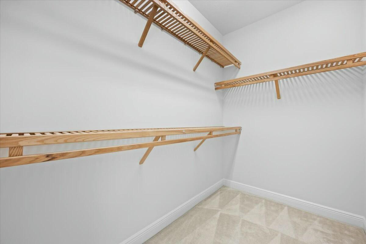 222 Tresana Boulevard, Unit 44 Jupiter, FL 33478 - Photo 19 of 63 a view of a room with racks on the wall