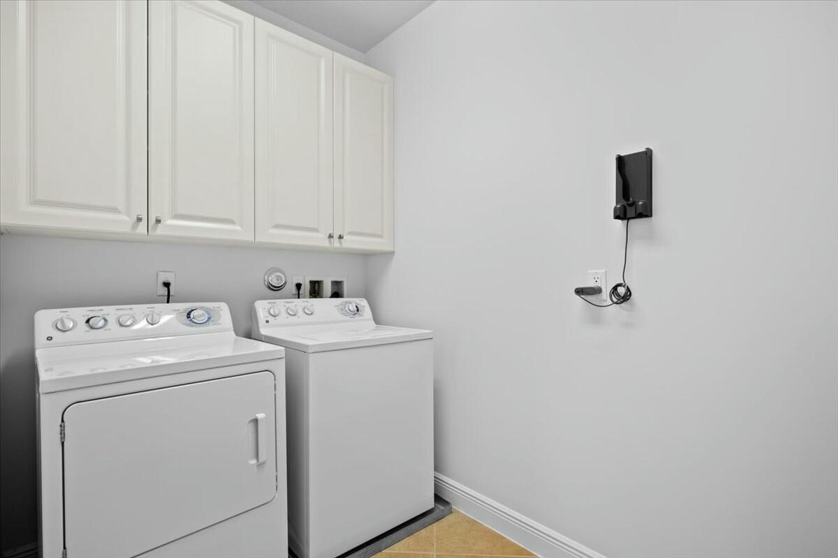 222 Tresana Boulevard, Unit 44 Jupiter, FL 33478 - Photo 25 of 63 a utility room with dryer and washer