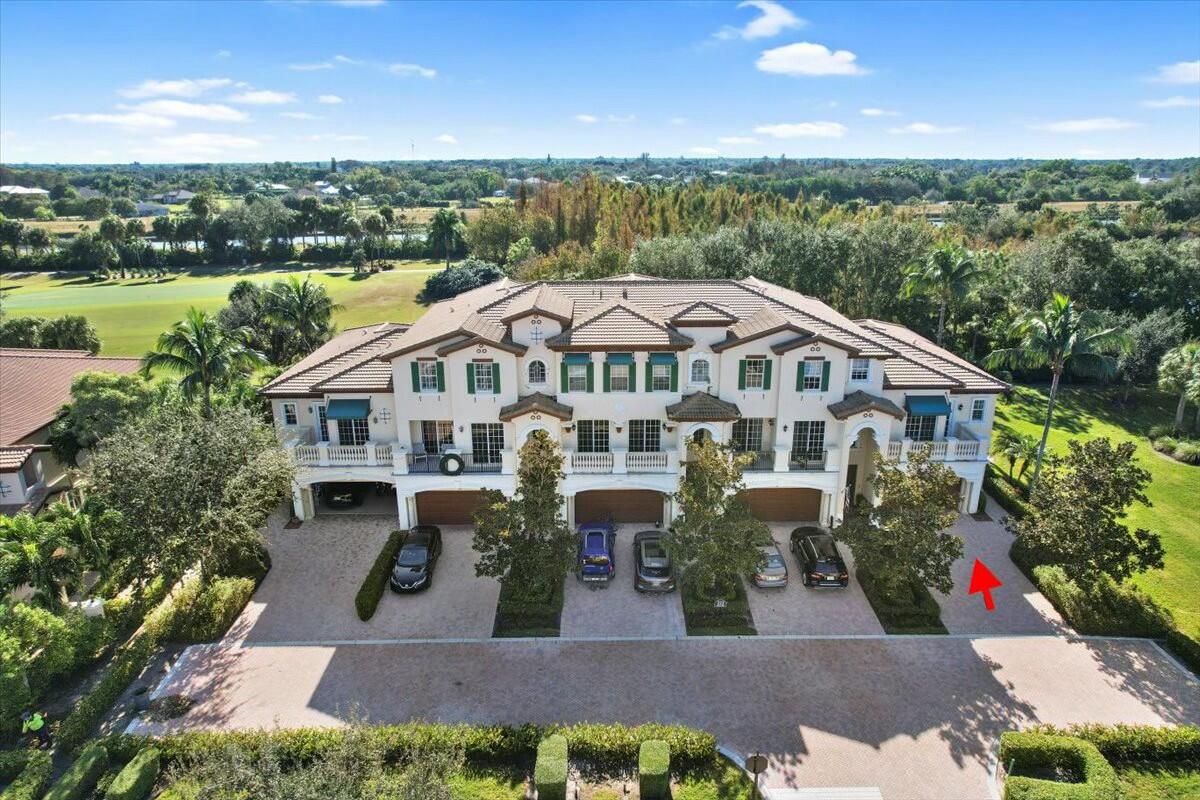 222 Tresana Boulevard, Unit 44 Jupiter, FL 33478 - Photo 34 of 63 a aerial view of a house with a yard