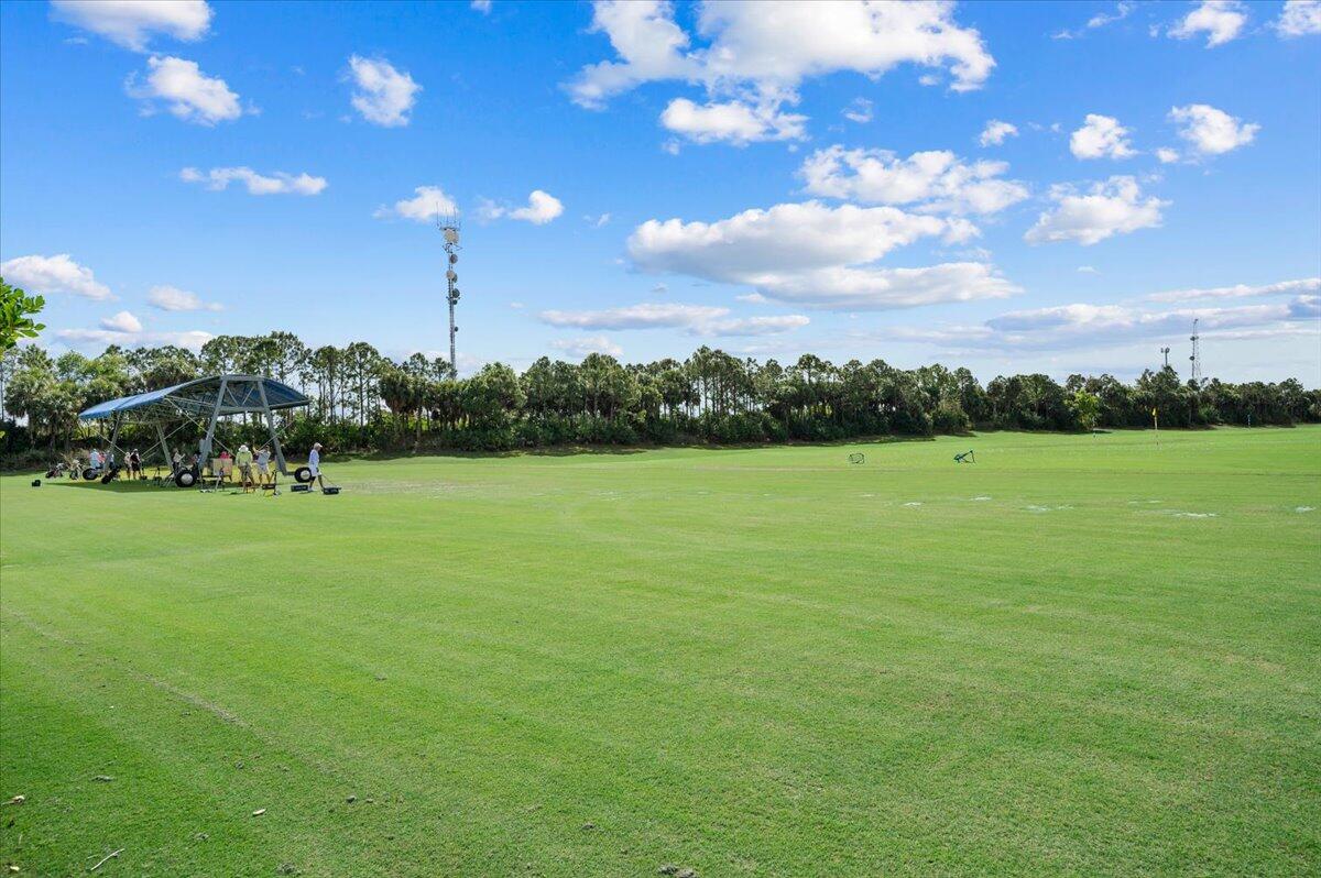 222 Tresana Boulevard, Unit 44 Jupiter, FL 33478 - Photo 49 of 63 a view of a golf course with a lake