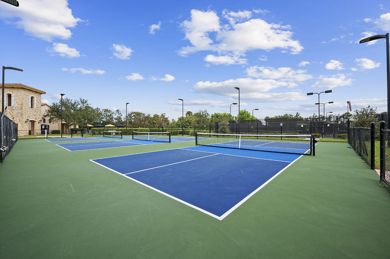 222 Tresana Boulevard, Unit 44 Jupiter, FL 33478 - Photo 51 of 63 a view of a tennis court