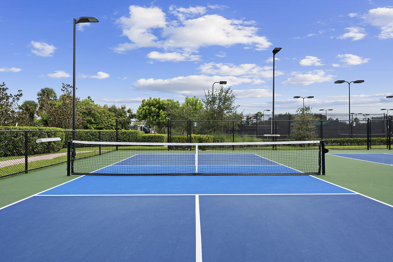 222 Tresana Boulevard, Unit 44 Jupiter, FL 33478 - Photo 52 of 63 a view of a tennis court