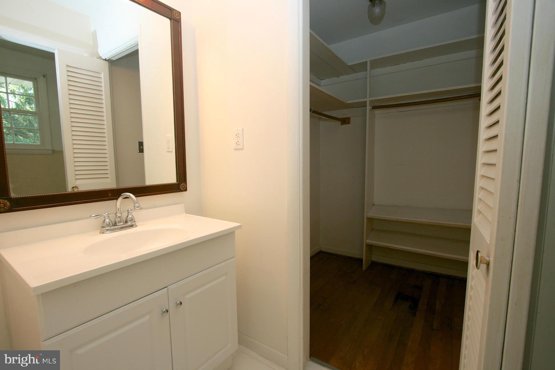 9429 Dartmouth Road Columbia, MD 21045 - Photo 12 of 27 a bathroom with a sink and a mirror