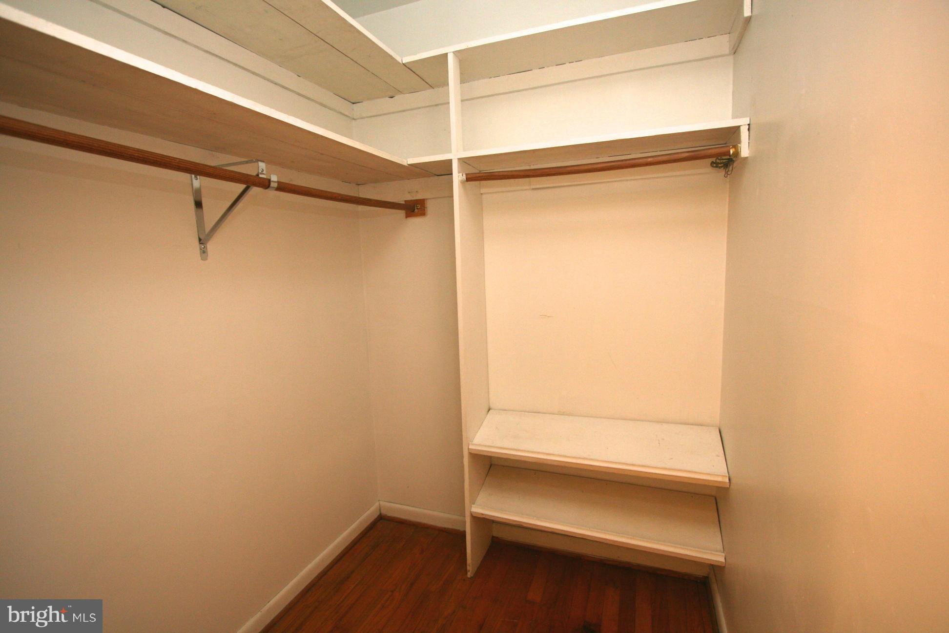 9429 Dartmouth Road Columbia, MD 21045 - Photo 14 of 27 a view of walk in closet with empty racks