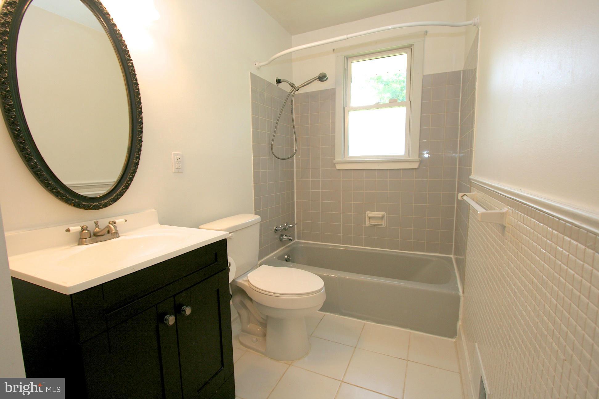 9429 Dartmouth Road Columbia, MD 21045 - Photo 16 of 27 a bathroom with a sink a toilet and a mirror