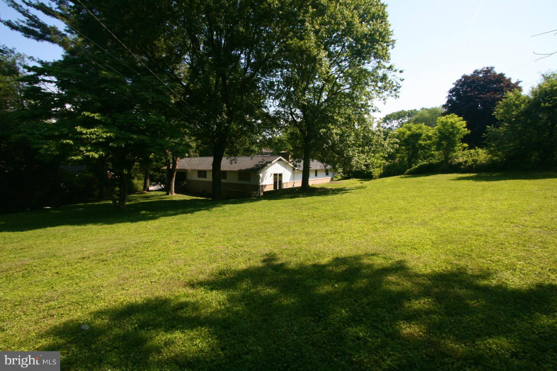 9429 Dartmouth Road Columbia, MD 21045 - Photo 21 of 27 a view of a swimming pool with a yard