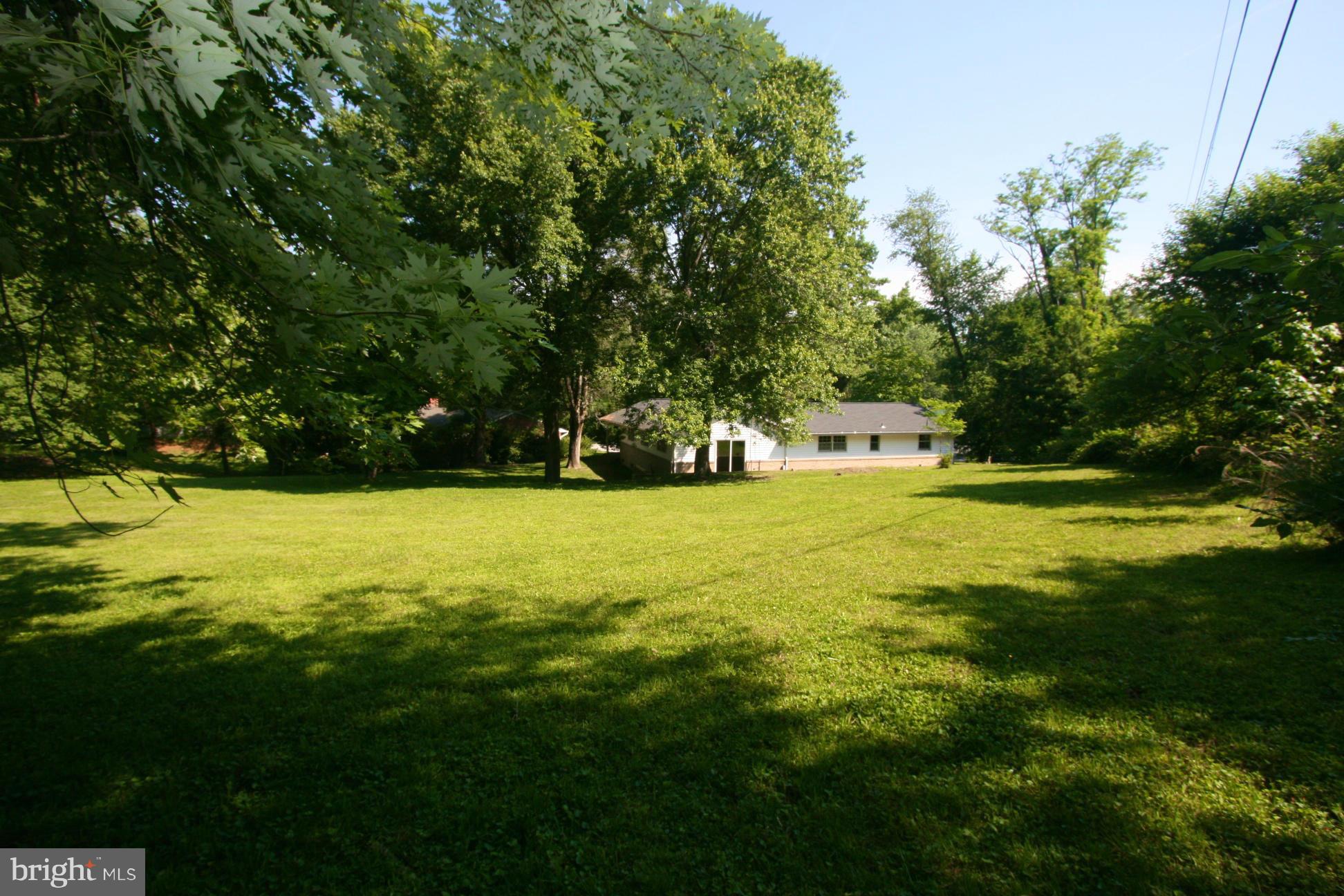 9429 Dartmouth Road Columbia, MD 21045 - Photo 22 of 27 a view of a swimming pool with a yard