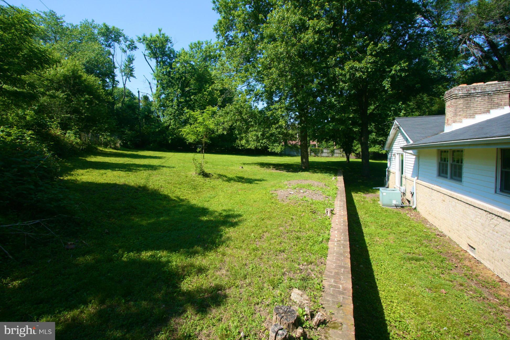 9429 Dartmouth Road Columbia, MD 21045 - Photo 24 of 27 a view of yard with swimming pool and green space