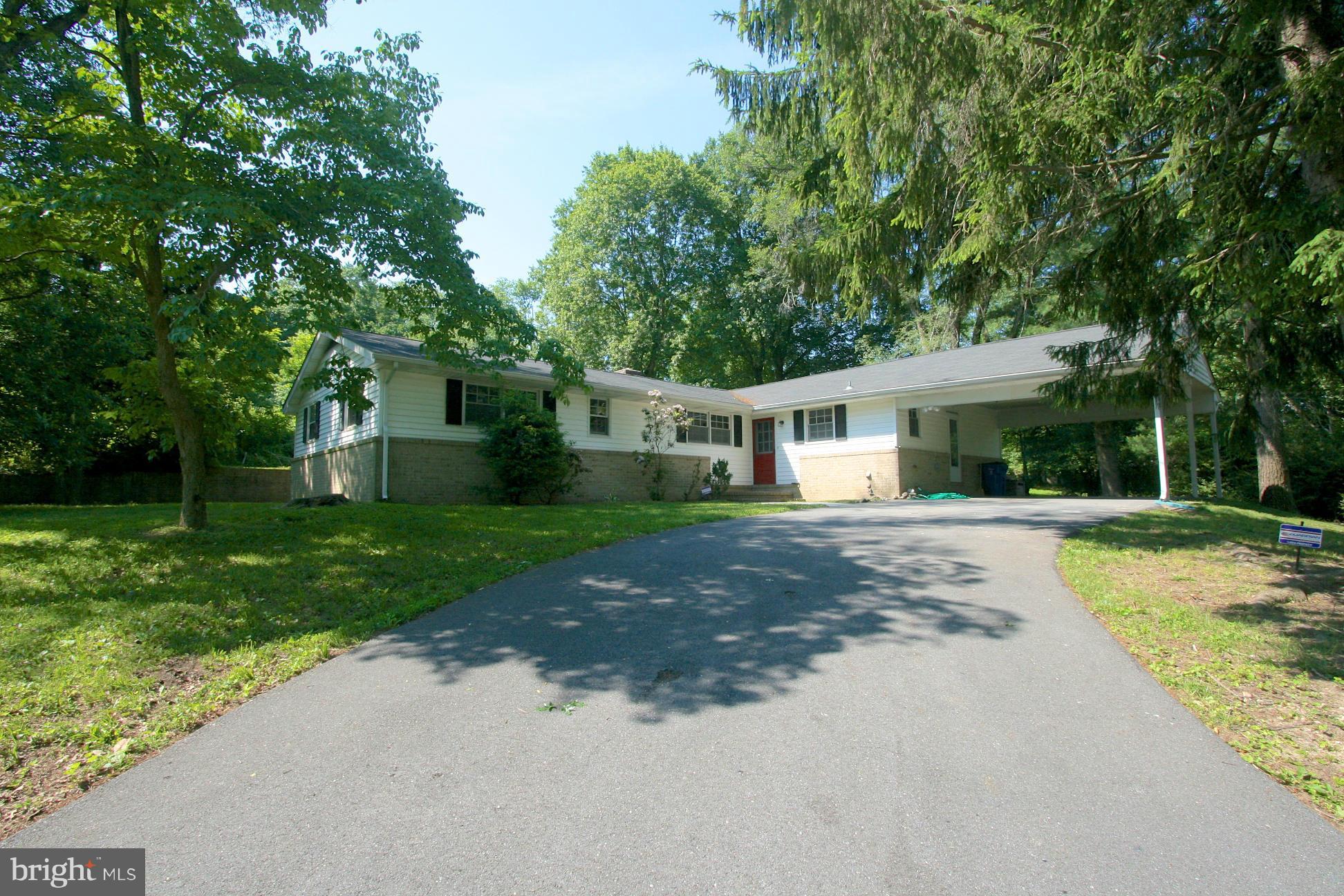 9429 Dartmouth Road Columbia, MD 21045 - Photo 25 of 27 a view of a house with a yard and large tree