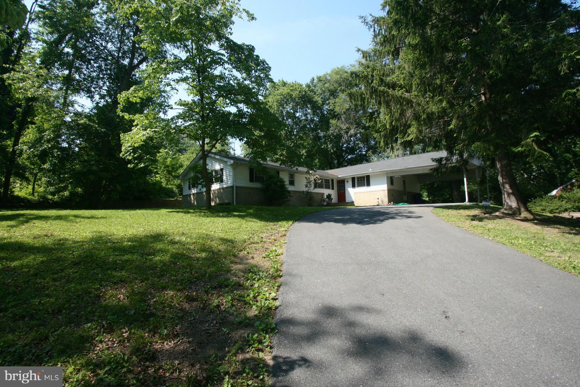 9429 Dartmouth Road Columbia, MD 21045 - Photo 26 of 27 a front view of house with yard and green space