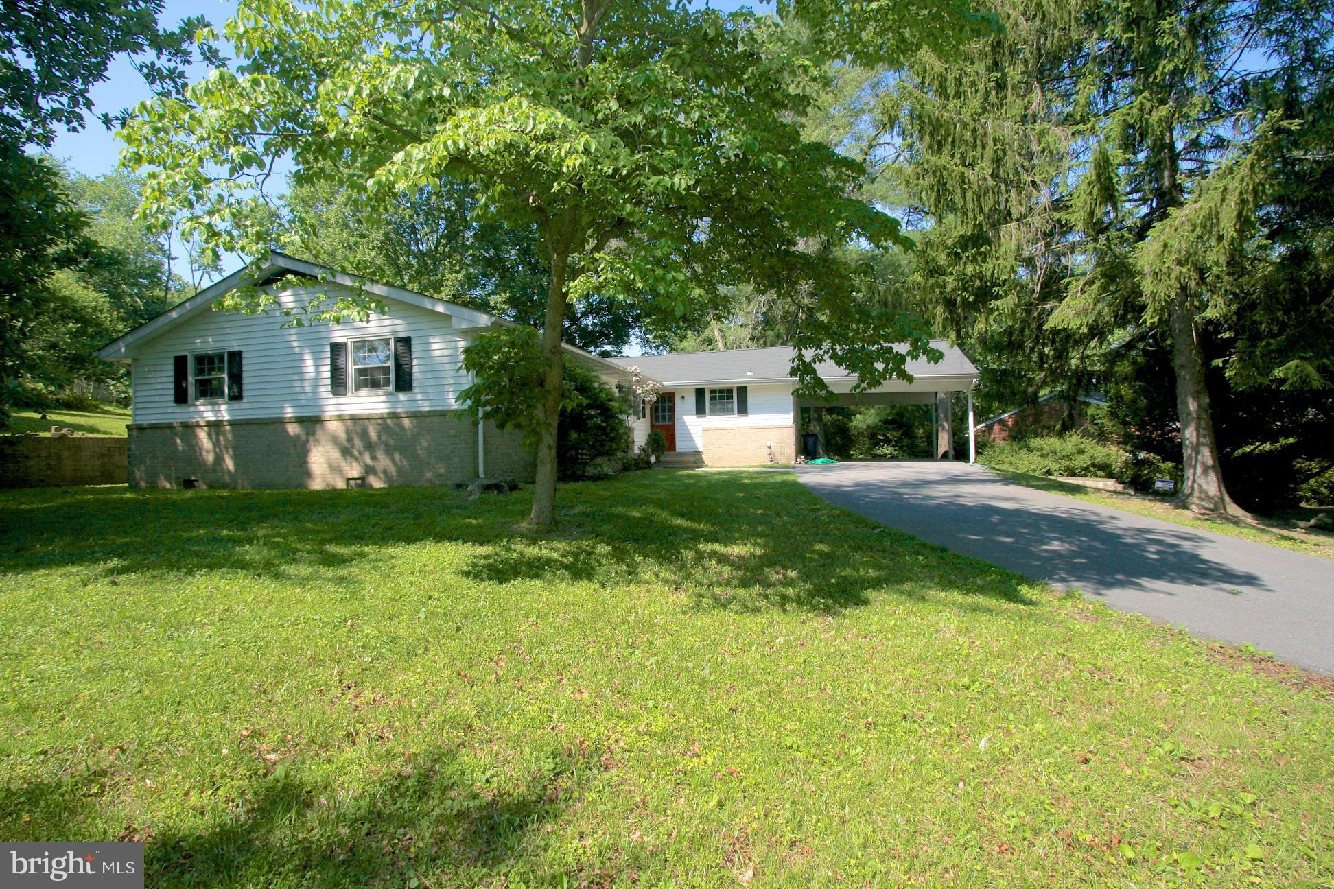 9429 Dartmouth Road Columbia, MD 21045 - Photo 27 of 27 a front view of a house with yard and green space