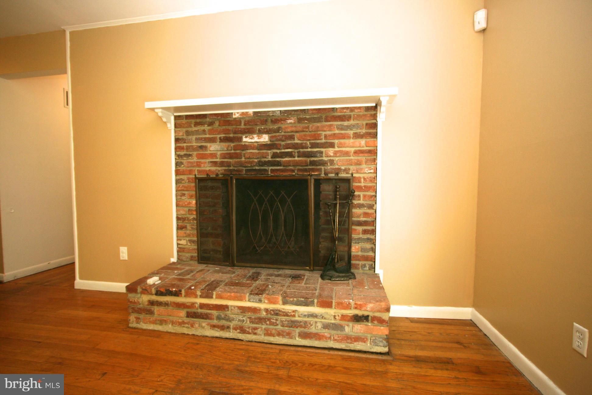 9429 Dartmouth Road Columbia, MD 21045 - Photo 5 of 27 a view of fireplace and wooden floor