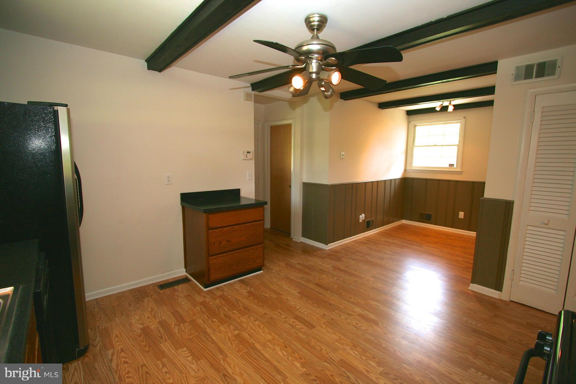 9429 Dartmouth Road Columbia, MD 21045 - Photo 8 of 27 a view of empty room with wooden floor