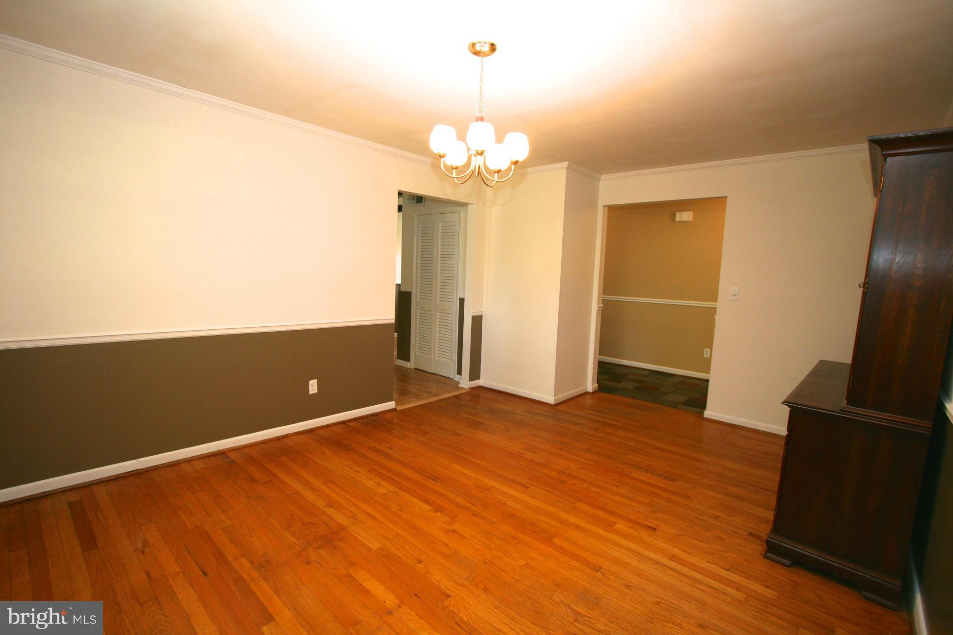 9429 Dartmouth Road Columbia, MD 21045 - Photo 10 of 27 a view of a livingroom with a chandelier