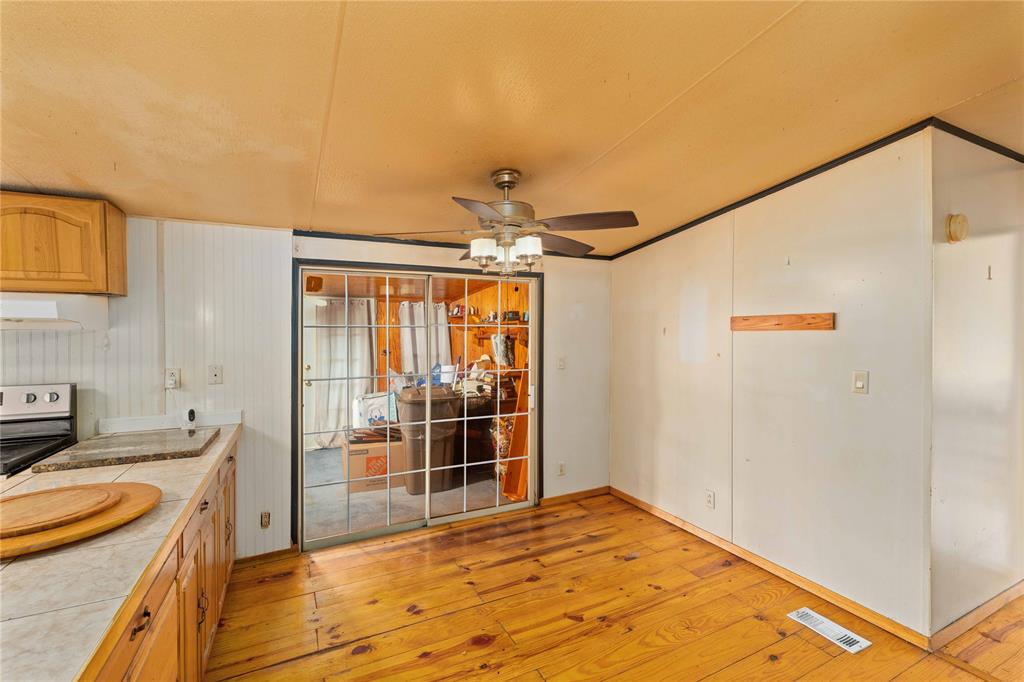 210 7th Street Blanket, TX 76432 - Photo 19 of 33 a room with a bed and a chandelier