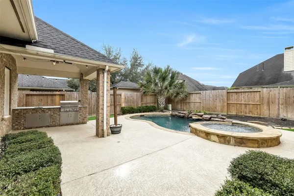 a view of a patio with swimming pool