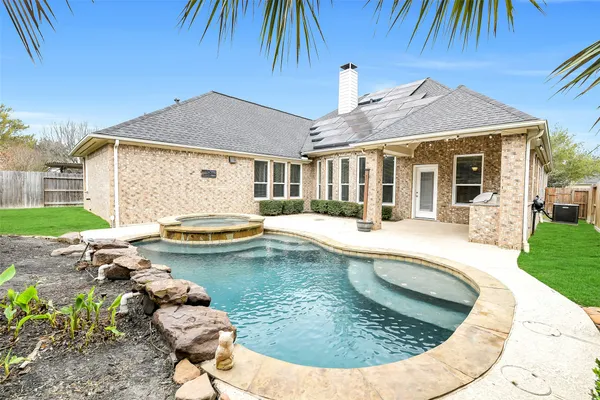 a view of a house with swimming pool and porch
