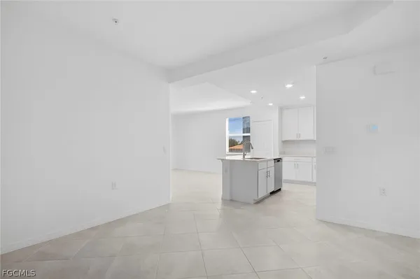 a kitchen with a refrigerator and a sink