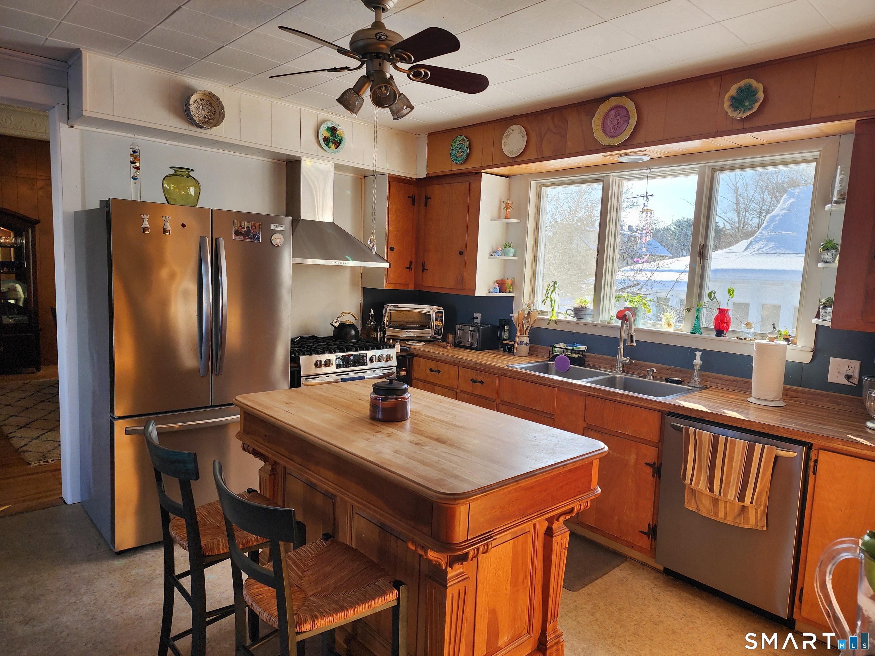 350 Hartford Pike Killingly, CT 06241 - Photo 10 of 28 a kitchen with stainless steel appliances a sink a refrigerator and a stove top oven