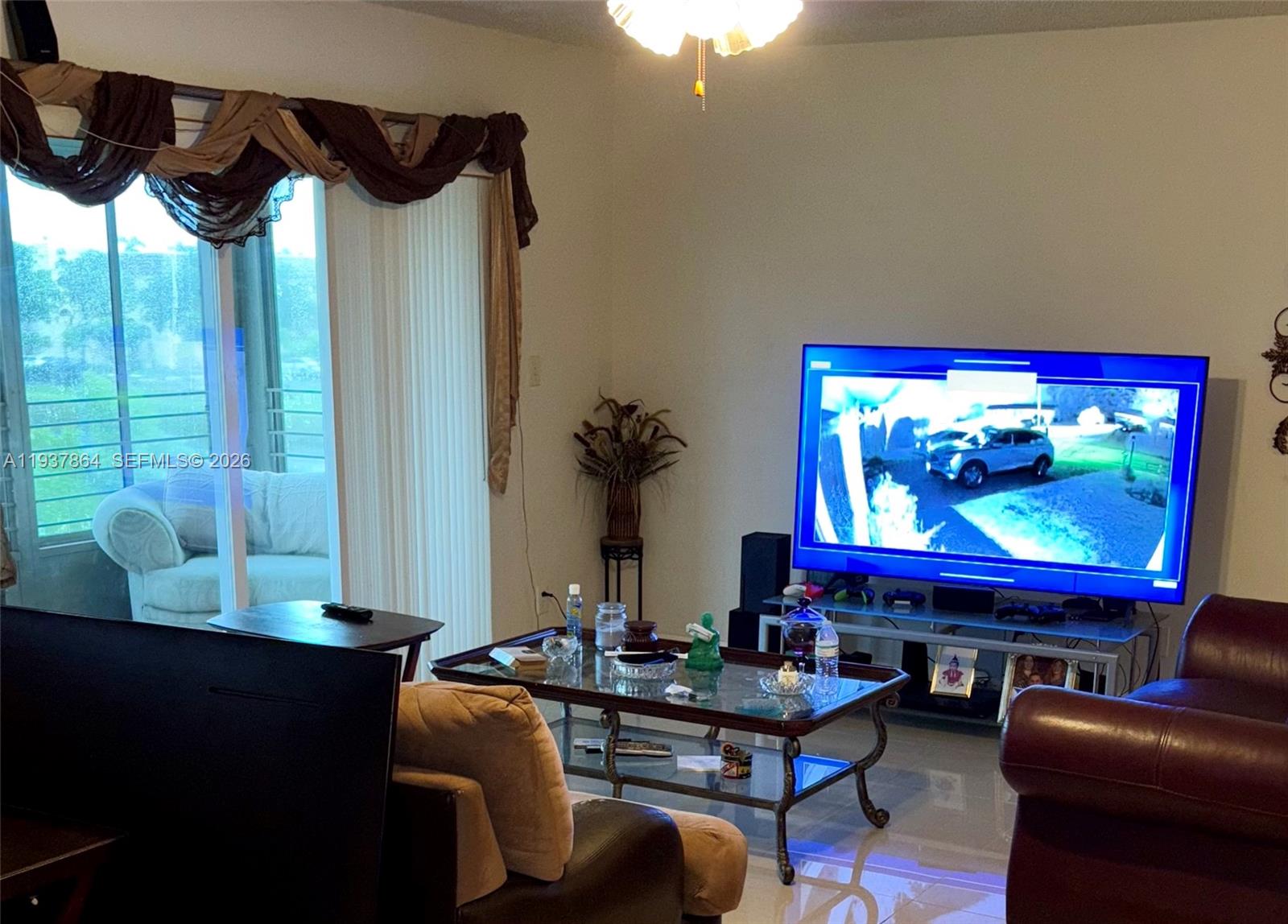 a living room with furniture and a flat screen tv