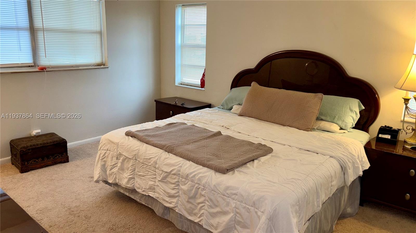 3120 North Pine Island Road, Unit 307 Sunrise, FL 33351 - Photo 3 of 17 a bedroom with a bed and a window