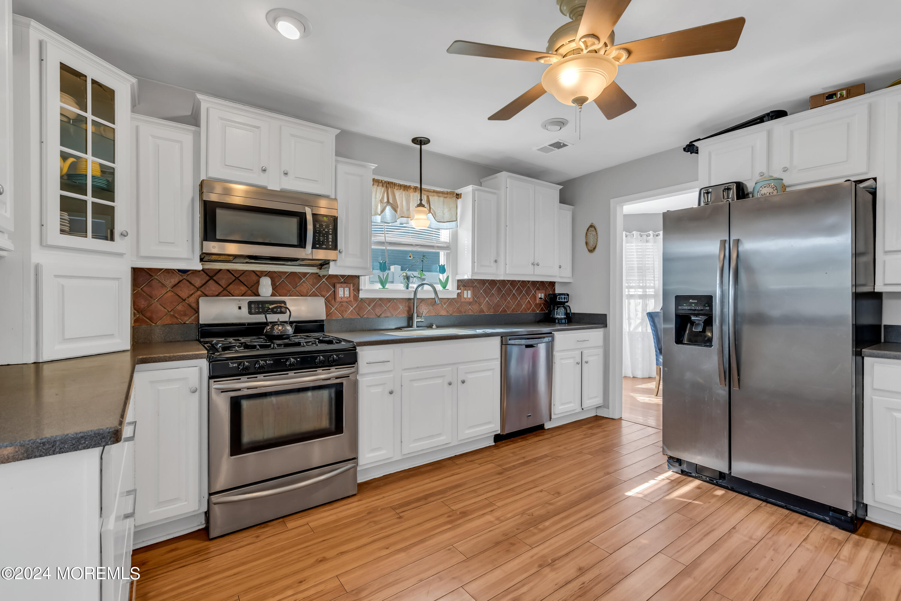 38 Concord Circle Howell, NJ 07731 - Photo 15 of 38 a kitchen with stainless steel appliances a stove microwave and refrigerator