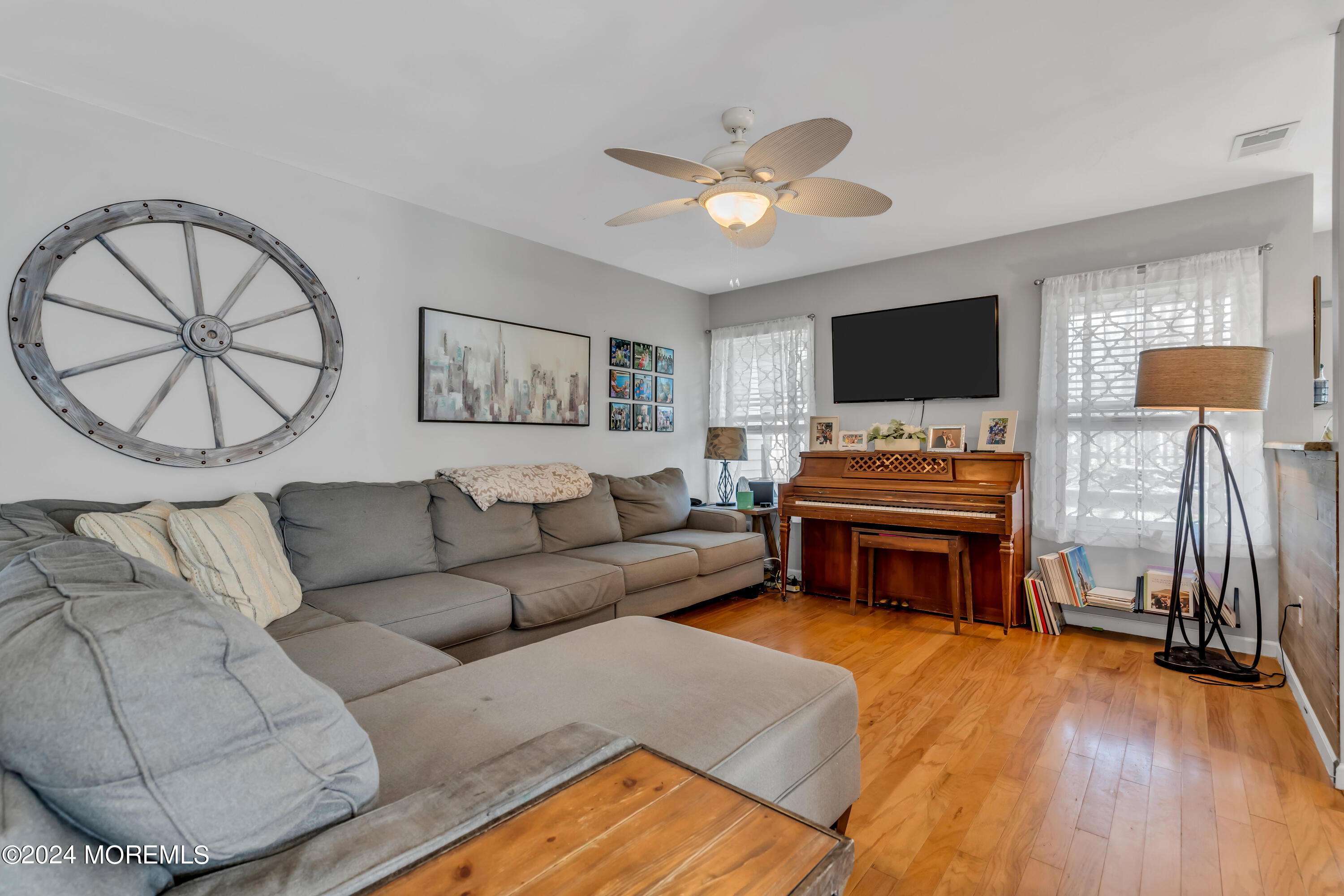 38 Concord Circle Howell, NJ 07731 - Photo 18 of 38 a living room with furniture and a flat screen tv with wooden floor