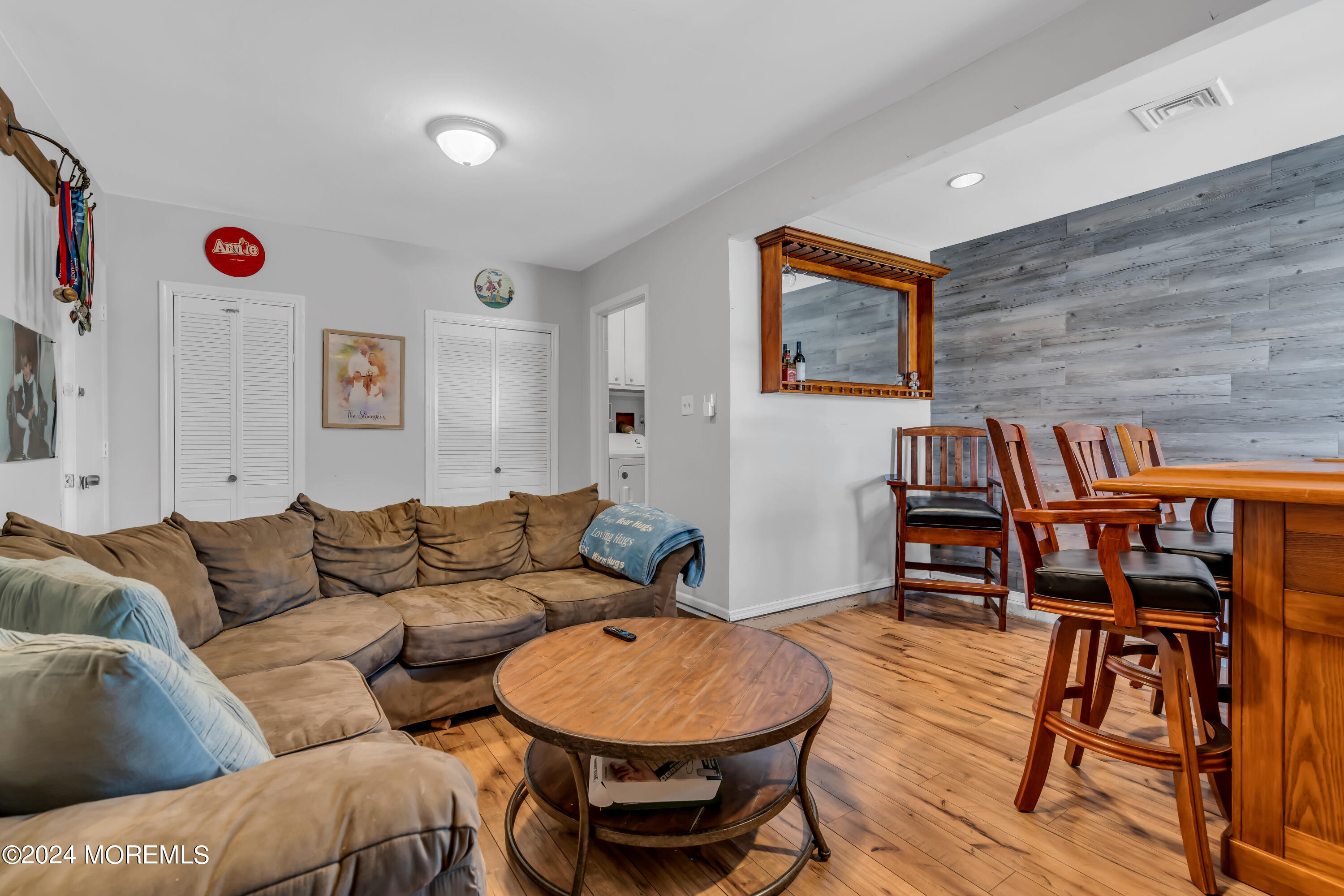 38 Concord Circle Howell, NJ 07731 - Photo 22 of 38 a living room with furniture and a wooden floor