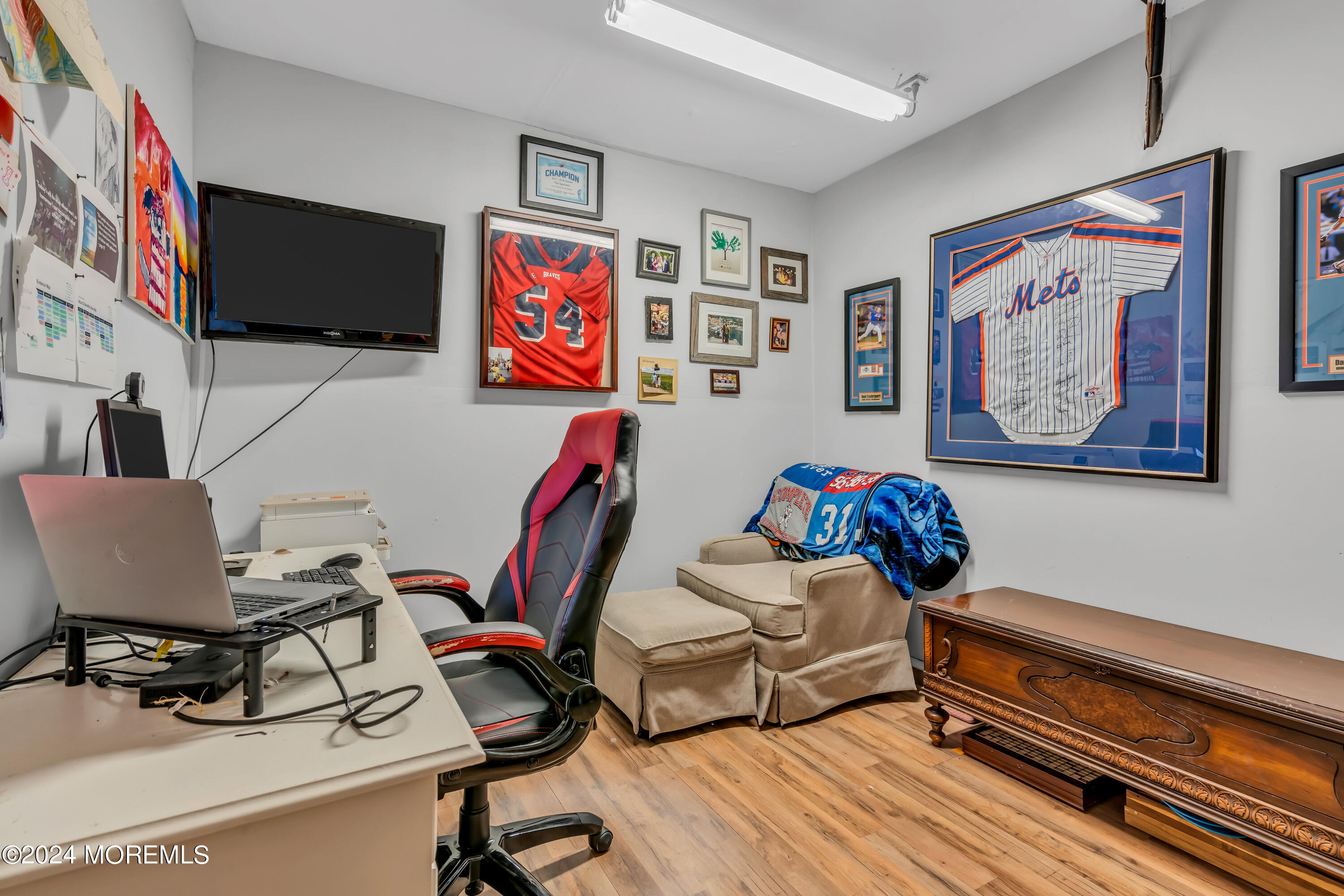 38 Concord Circle Howell, NJ 07731 - Photo 24 of 38 a view of a workspace with furniture and a flat screen tv