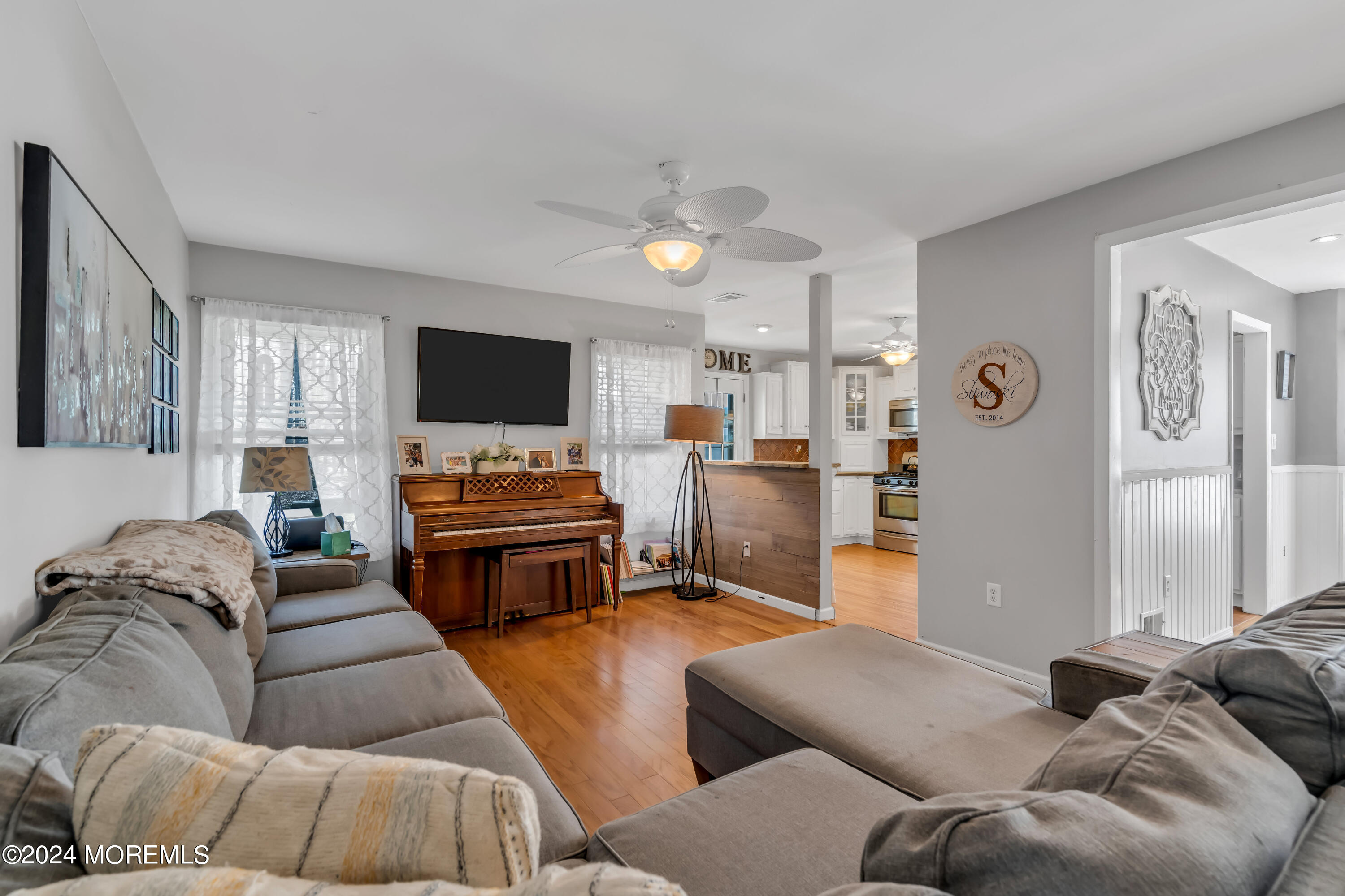 38 Concord Circle Howell, NJ 07731 - Photo 25 of 38 a living room with furniture and a flat screen tv