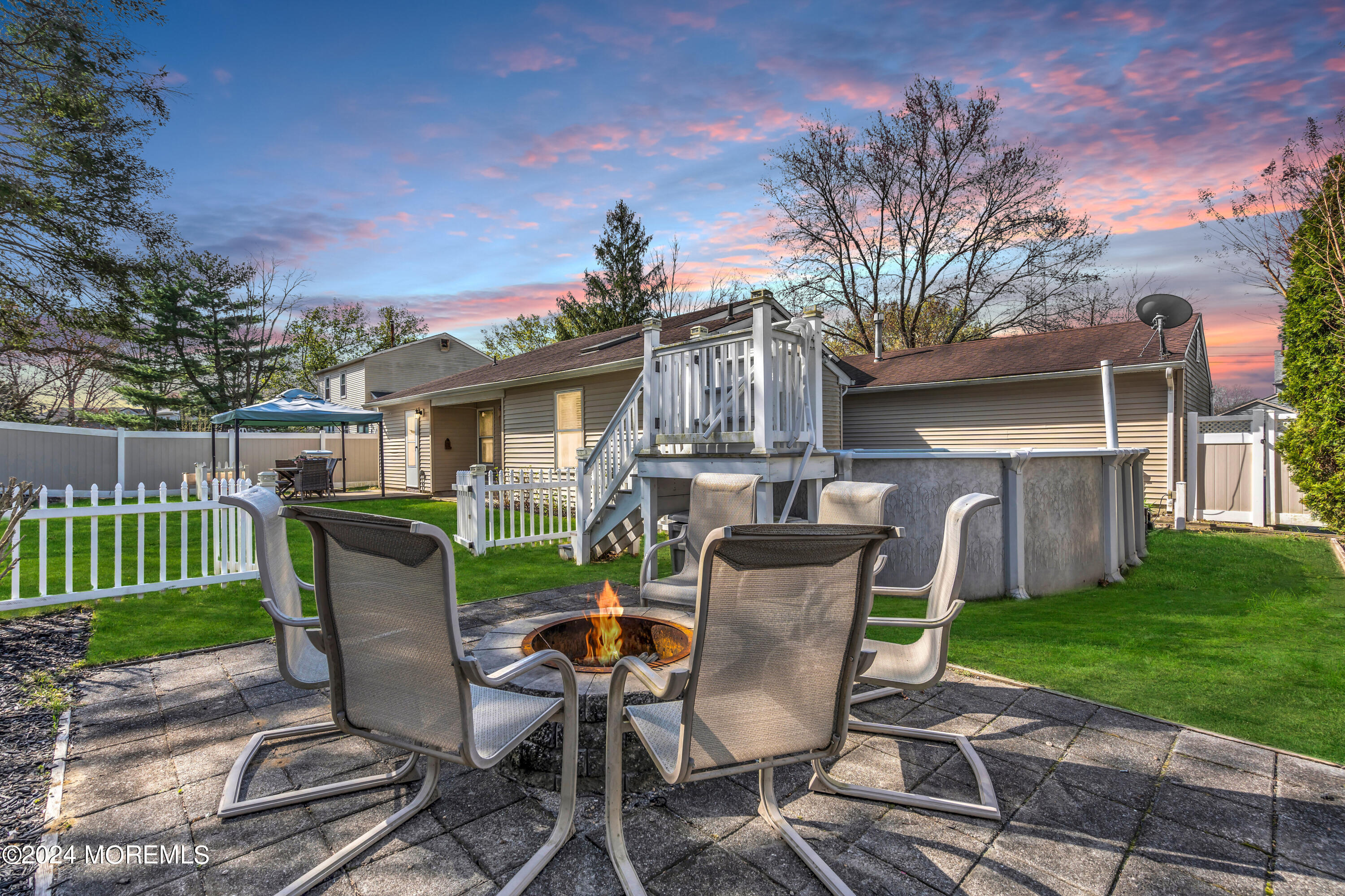 38 Concord Circle Howell, NJ 07731 - Photo 7 of 38 a view of a patio with table and chairs and potted plants
