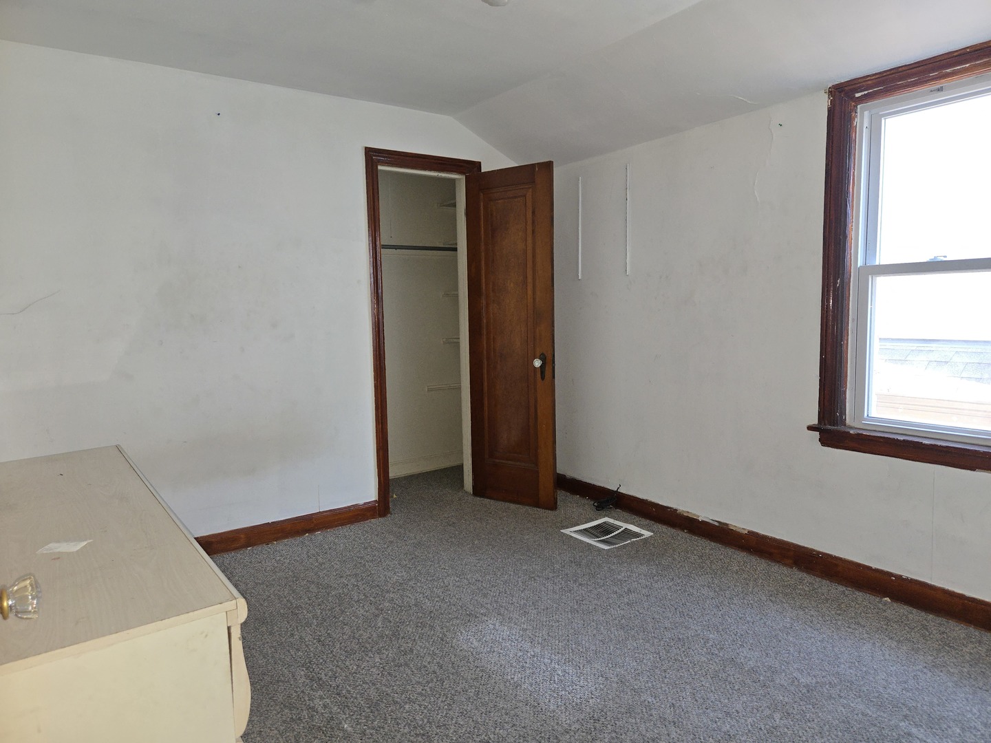 5204 West Newport Avenue, Unit 2 Chicago, IL 60641 - Photo 7 of 10 an empty room with windows
