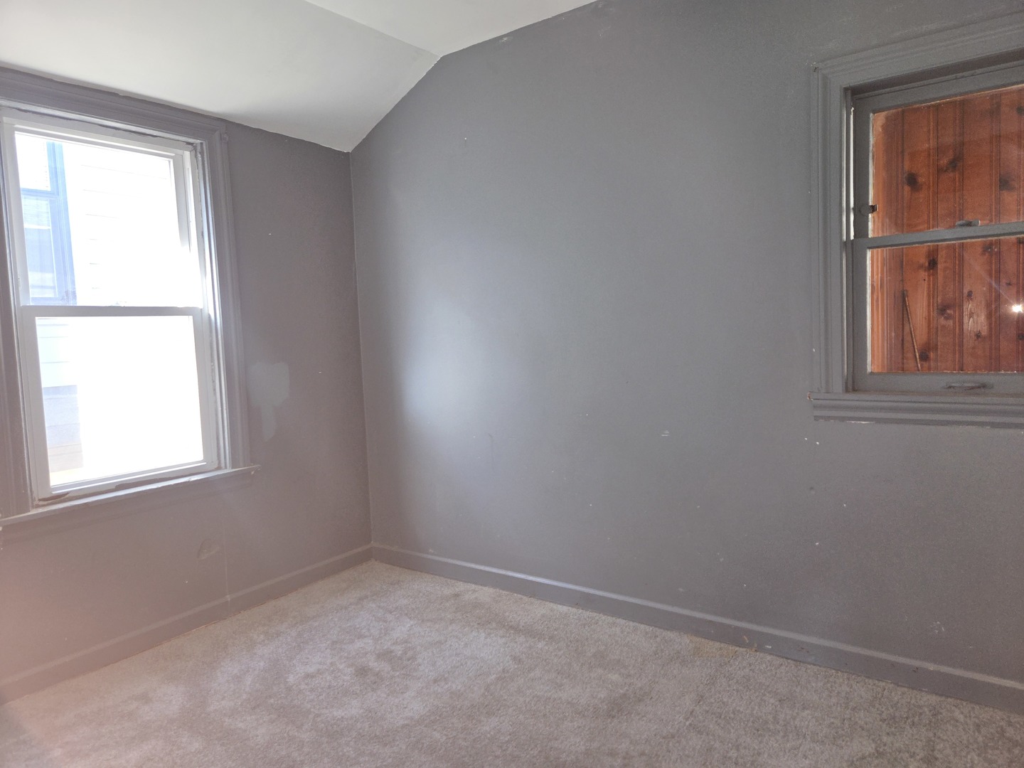 5204 West Newport Avenue, Unit 2 Chicago, IL 60641 - Photo 9 of 10 an empty room with a window