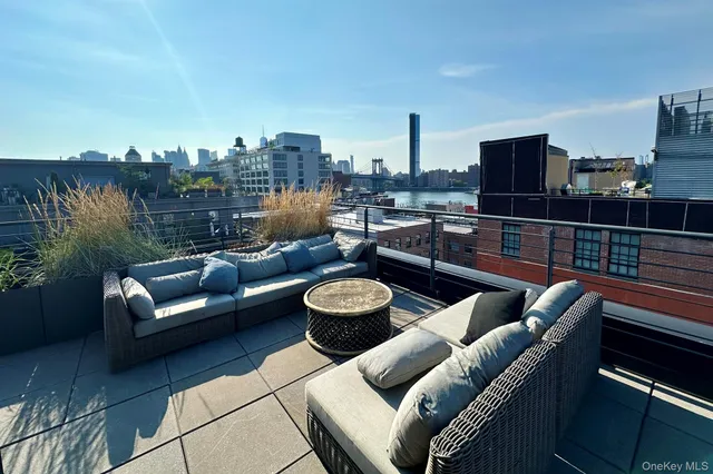 a view of a terrace with furniture