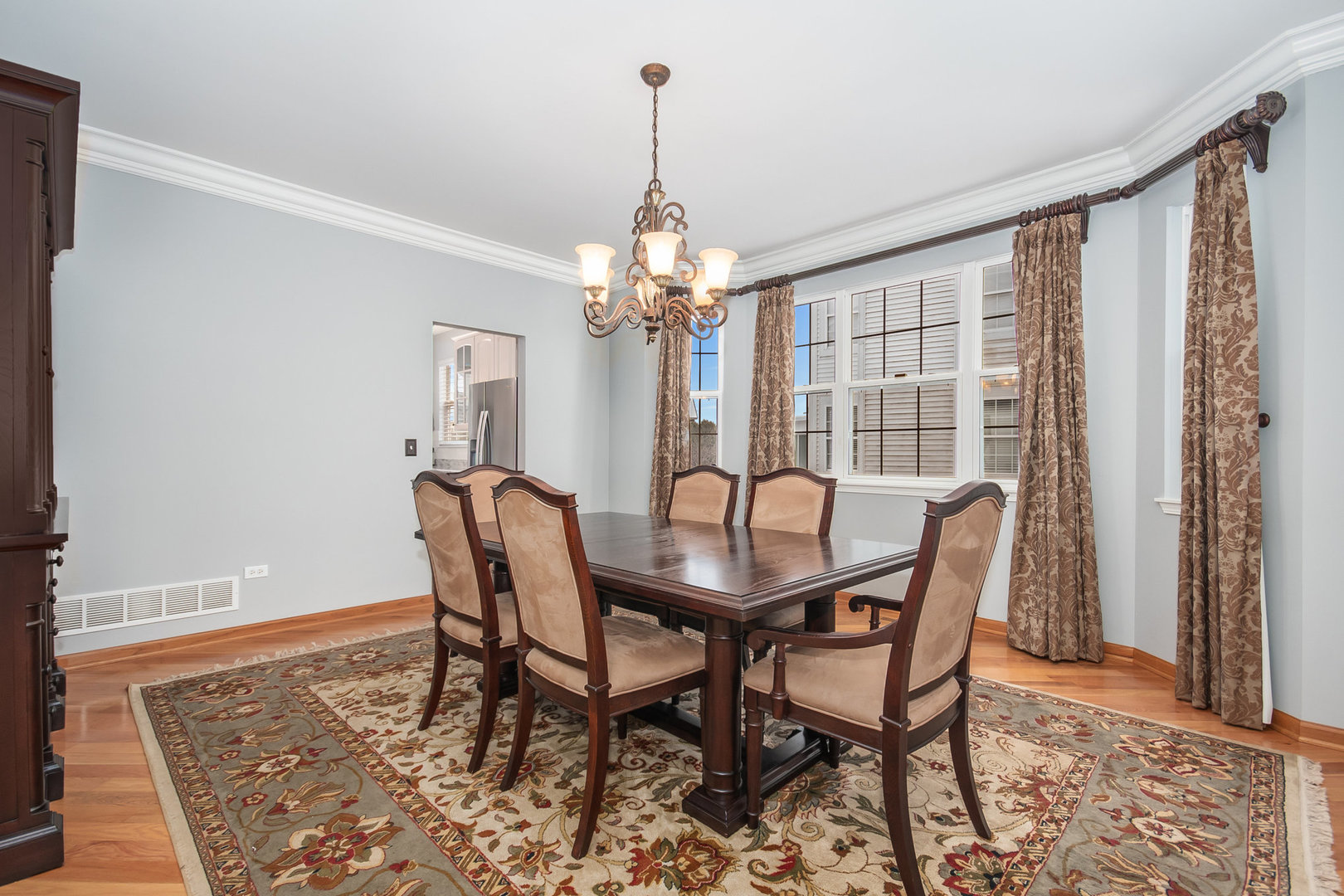 712 Eagle Brook Lane Naperville, IL 60565 - Photo 11 of 40 a view of a dining room with furniture and window