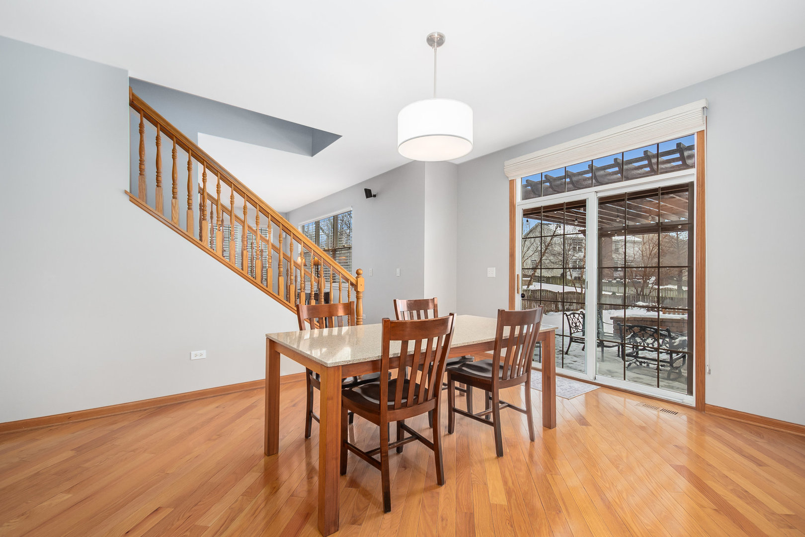 712 Eagle Brook Lane Naperville, IL 60565 - Photo 14 of 40 a view of a dining room with furniture window and wooden floor